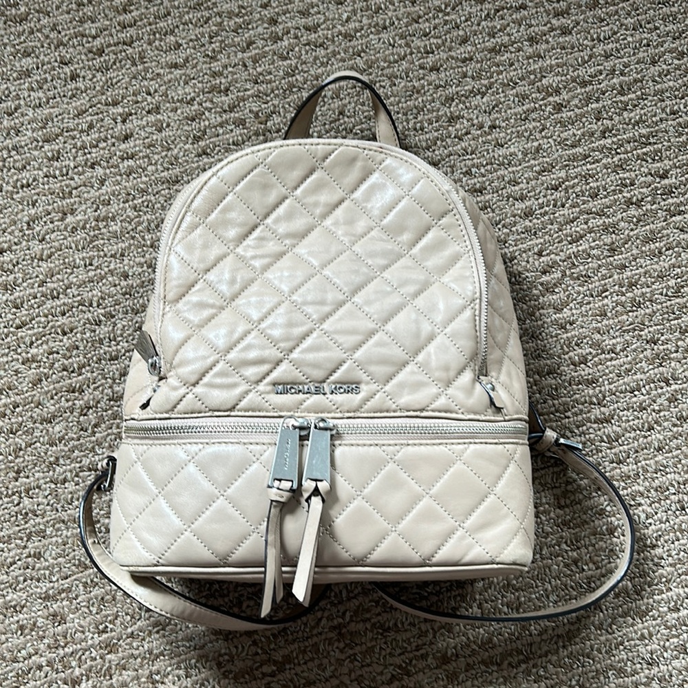 MK Tan color backpack